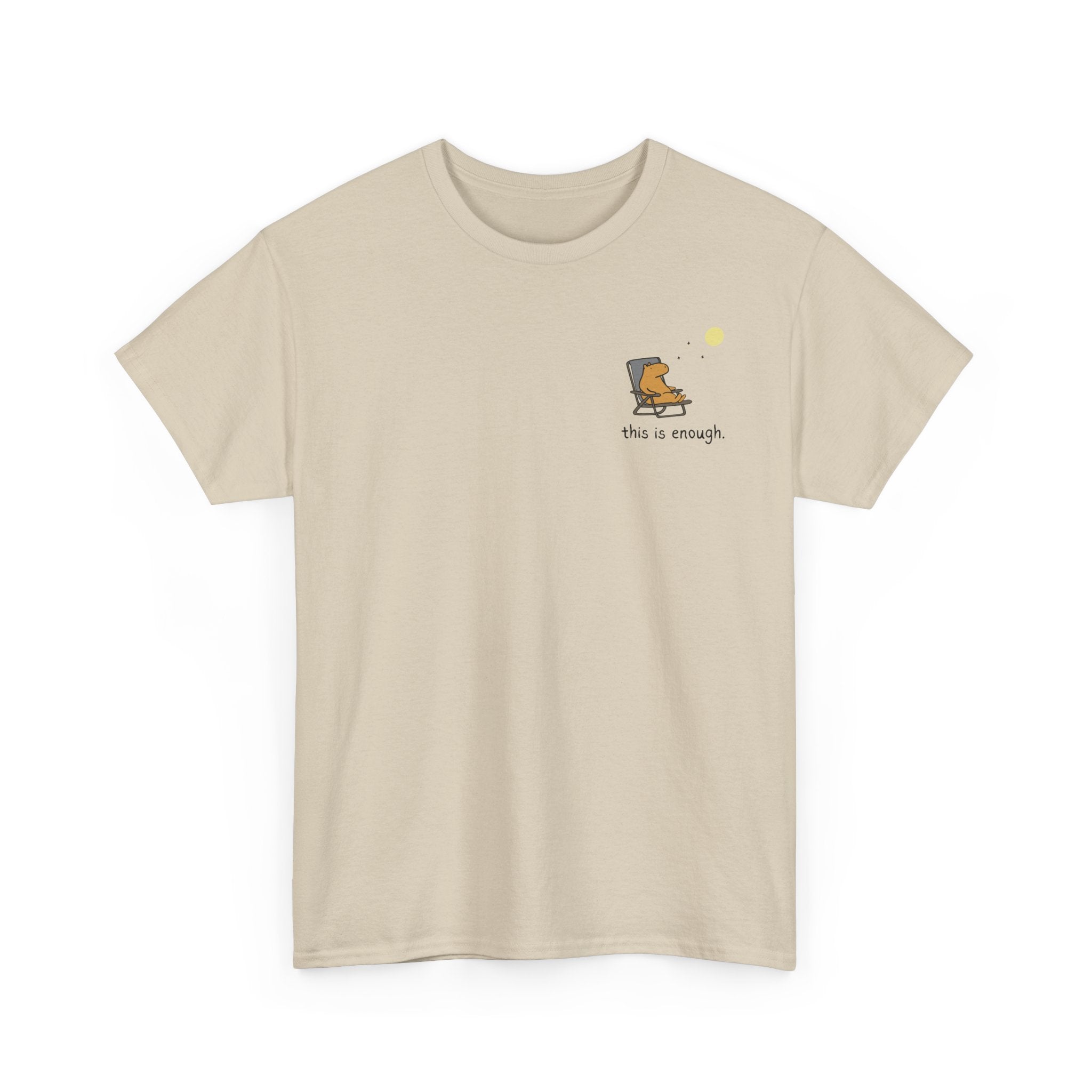 Tan colored shirt with a capybara in a lawn chair and the phrase "this is enough." in a left logo design.
