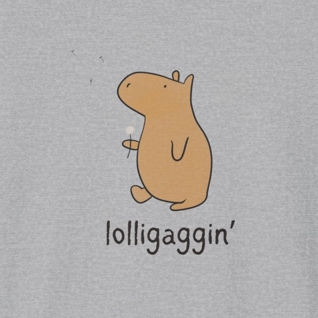 A light gray heather crewneck t-shirt featuring a cartoon capybara graphic in tan with the text 'lolligaggin'' printed below it, displayed on a clean white background.