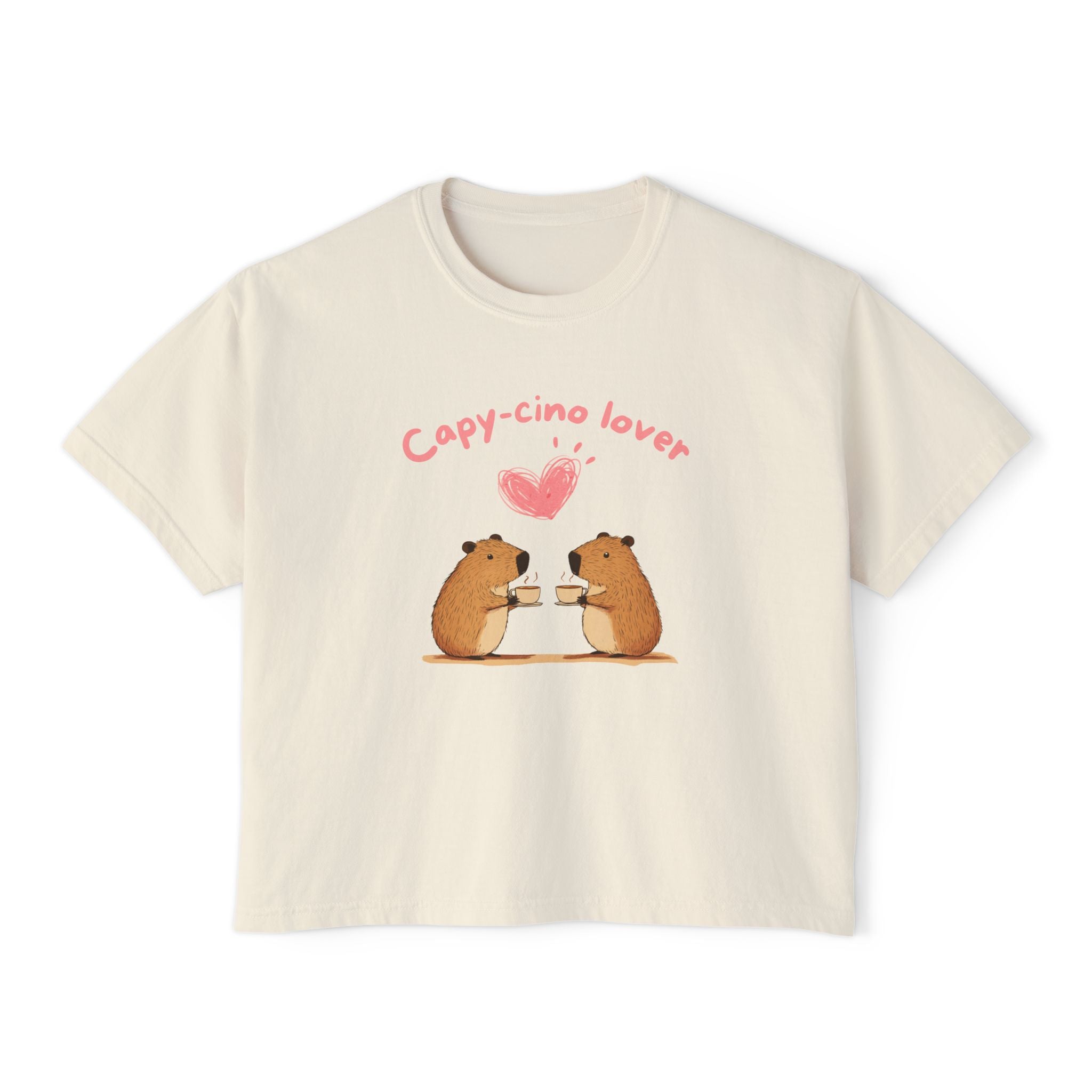 Beige women's boxy t-shirt with illustration of two capybaras enjoying coffee and heart shape above