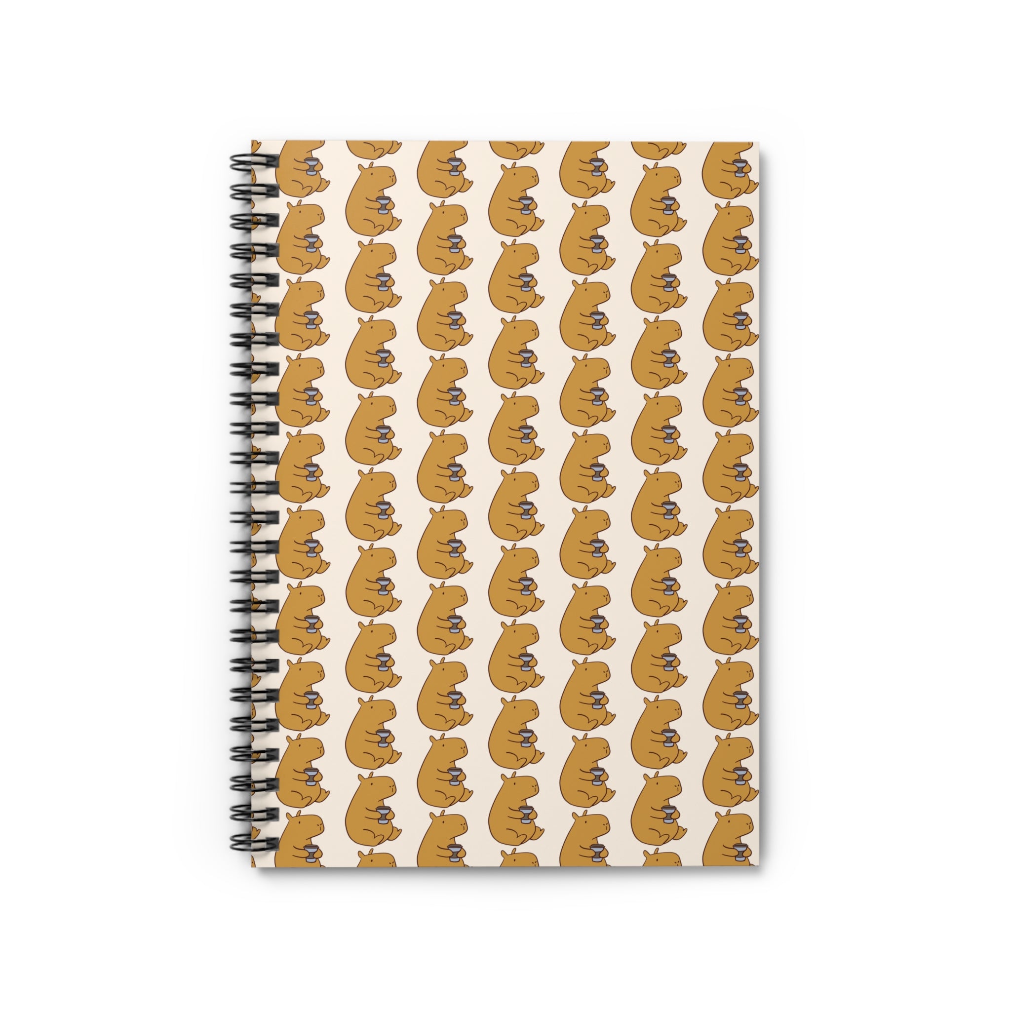 Notebook with a pattern of capybaras drinking coffee on a beige background