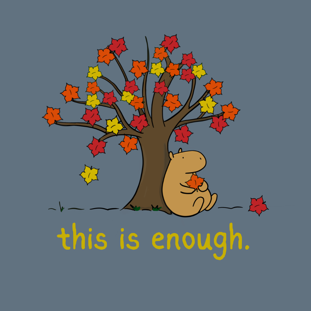 Capy Life long sleeve tee graphic featuring a cute capybara sitting under an autumn tree with red and yellow leaves.
