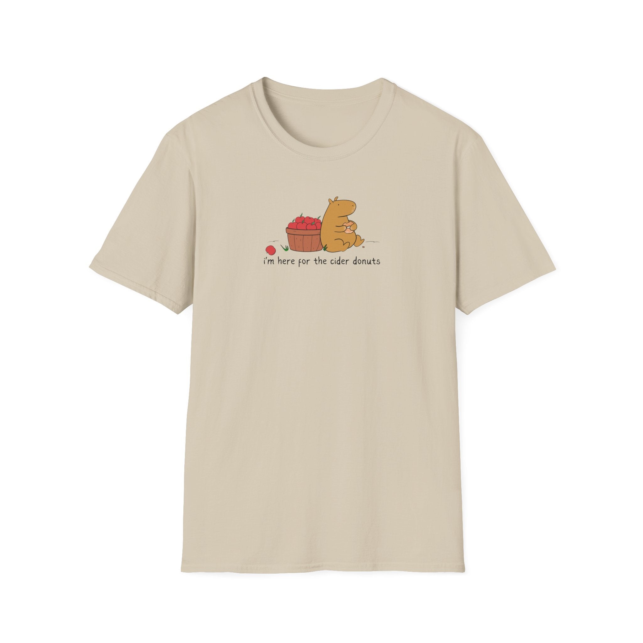 Capy Life softstyle t-shirt in beige featuring a hand-drawn capybara eating a cider donut next to a basket of apples.