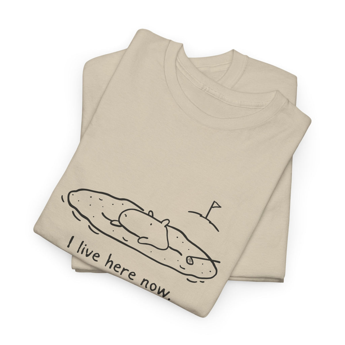 Capy Life beige heavy cotton t-shirt with a minimalist line drawing of a capybara relaxing in a golf sand bunker.