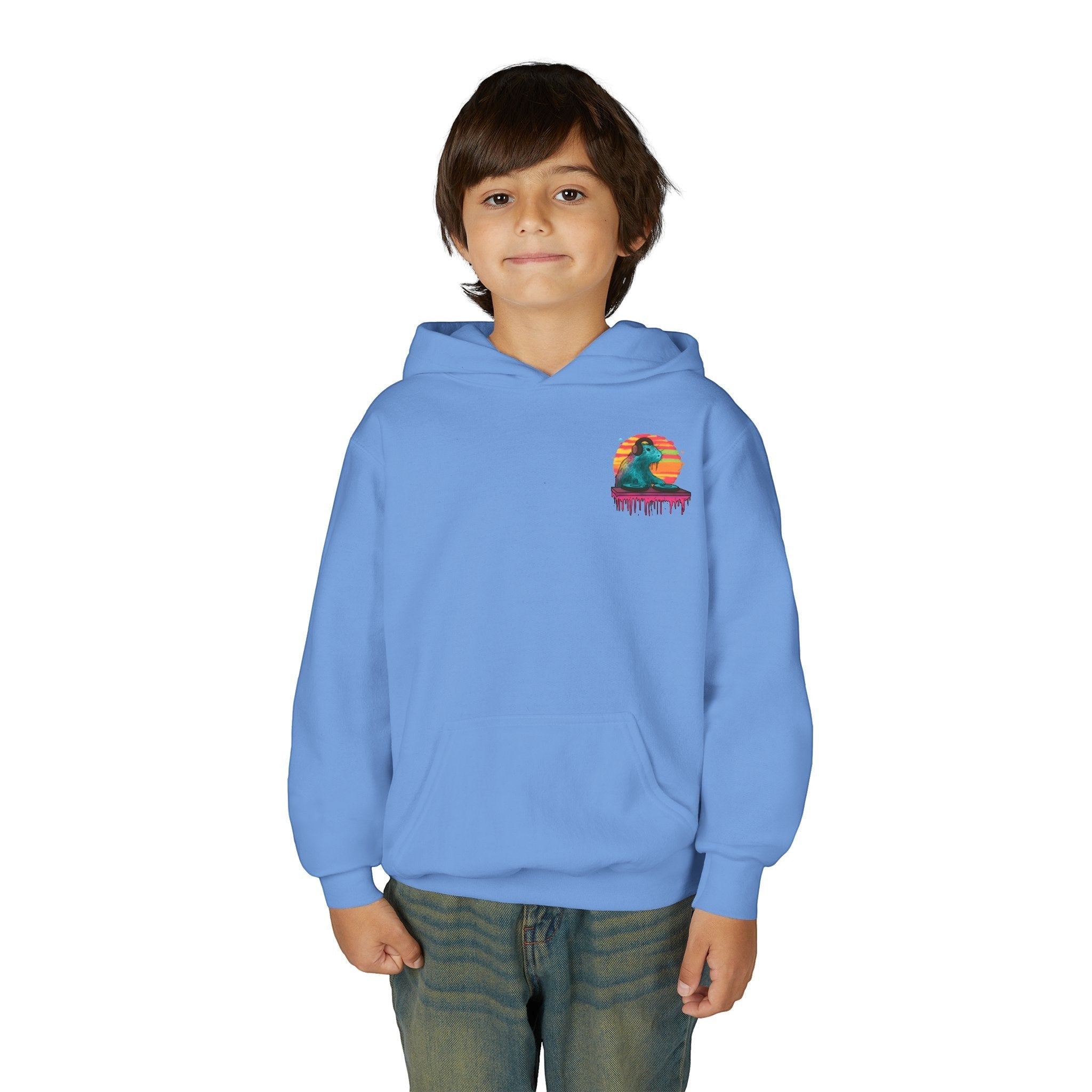 A young boy wearing a light blue Capy Life kids hoodie featuring a small DJ capybara graphic on the chest.