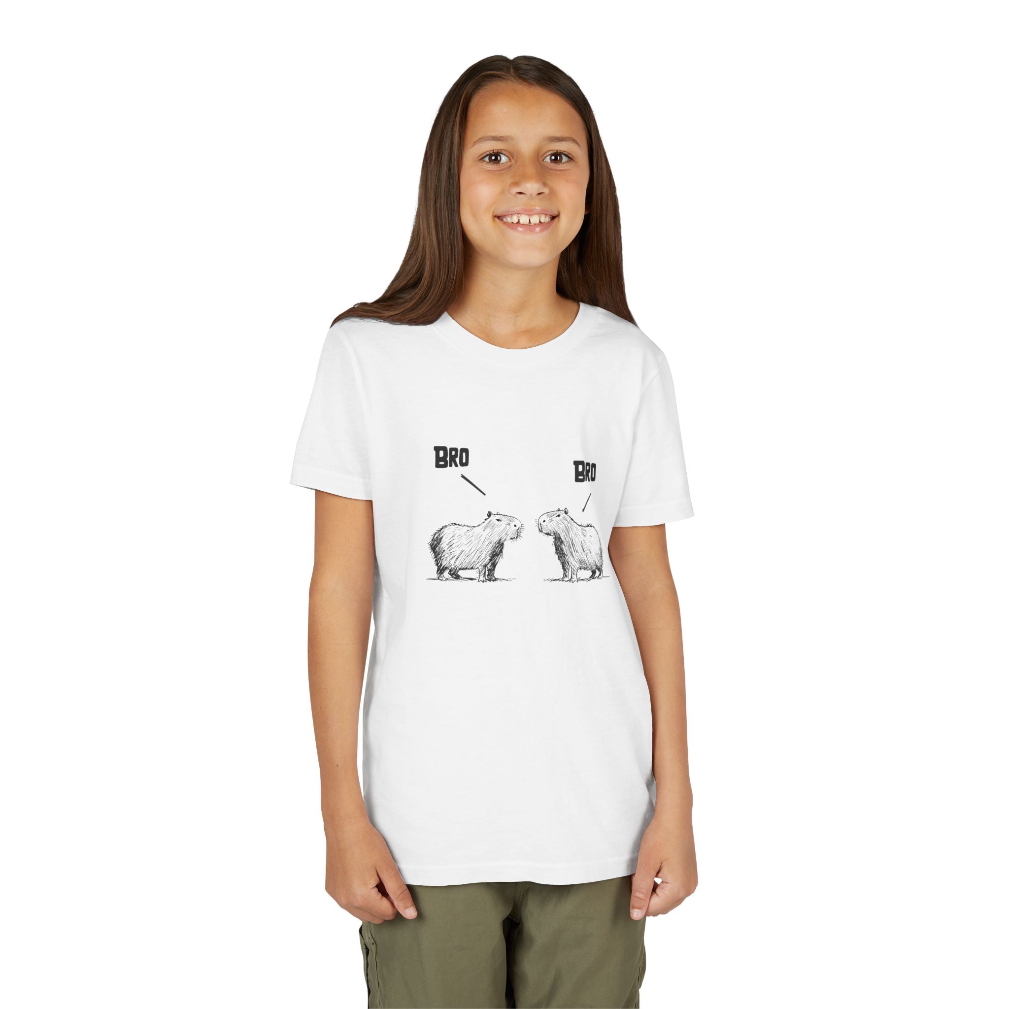 A young girl smiling while wearing a white Capy Life cotton t-shirt featuring a sketch of two capybaras saying Bro.
