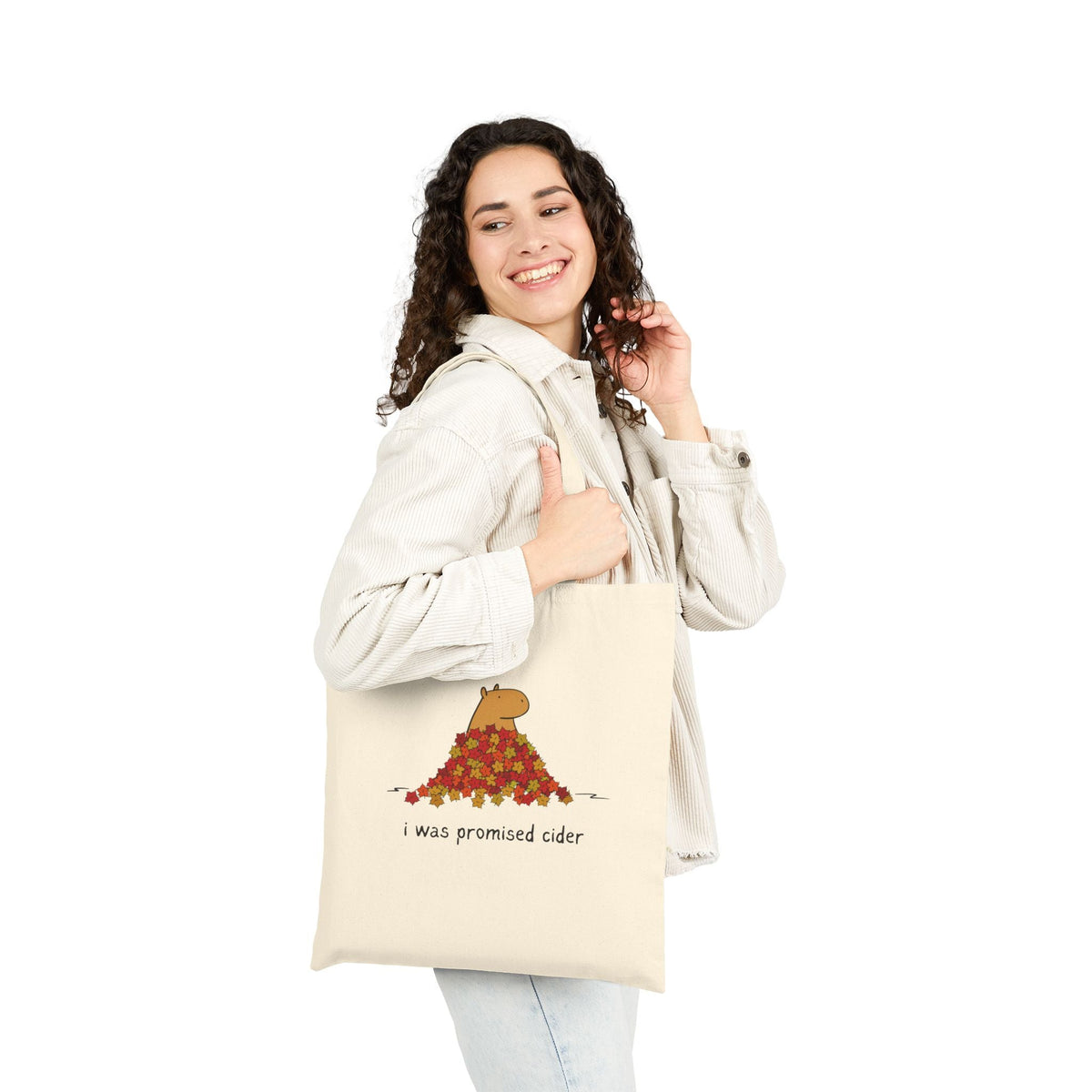 Capy Life natural canvas tote bag featuring a capybara in autumn leaves with the text I was promised cider