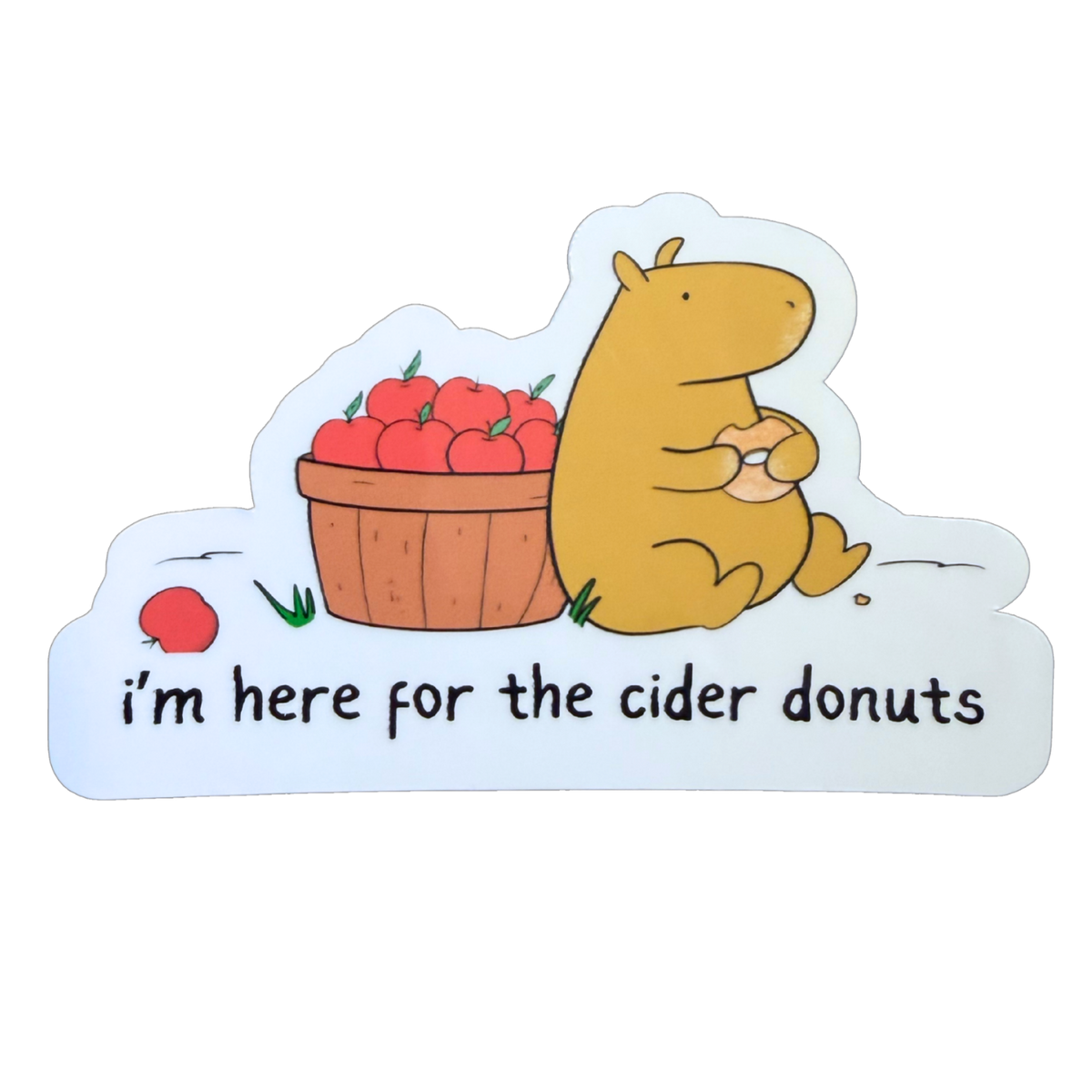 Capy Life die-cut sticker featuring Gene the capybara eating a cider donut next to a basket of red apples.