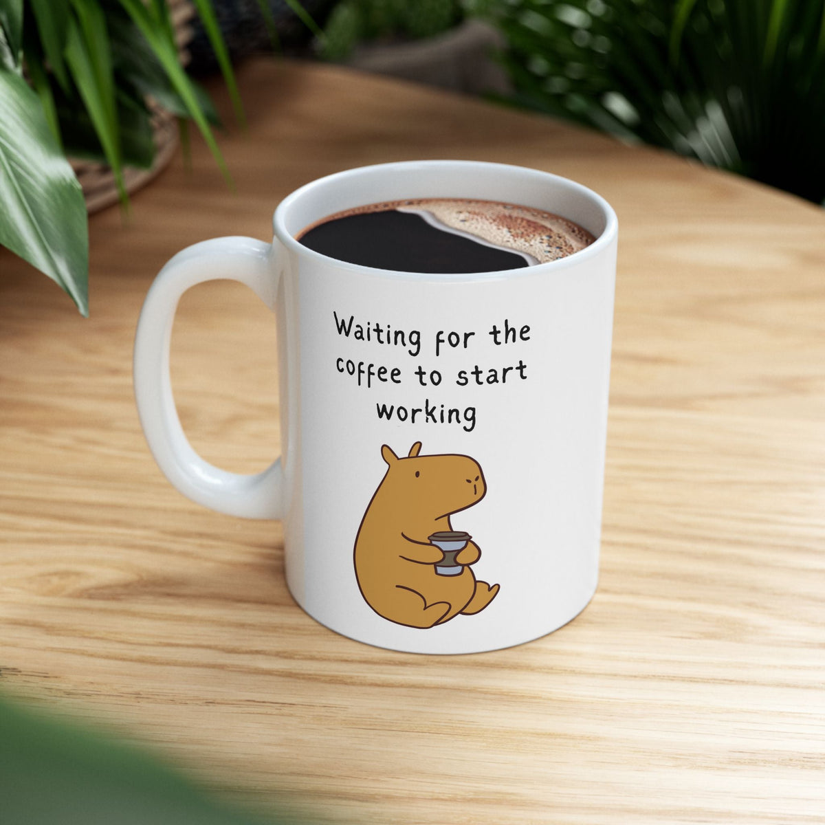 Capy Life white ceramic mug featuring a cute capybara illustration and the text Waiting for the coffee to start working