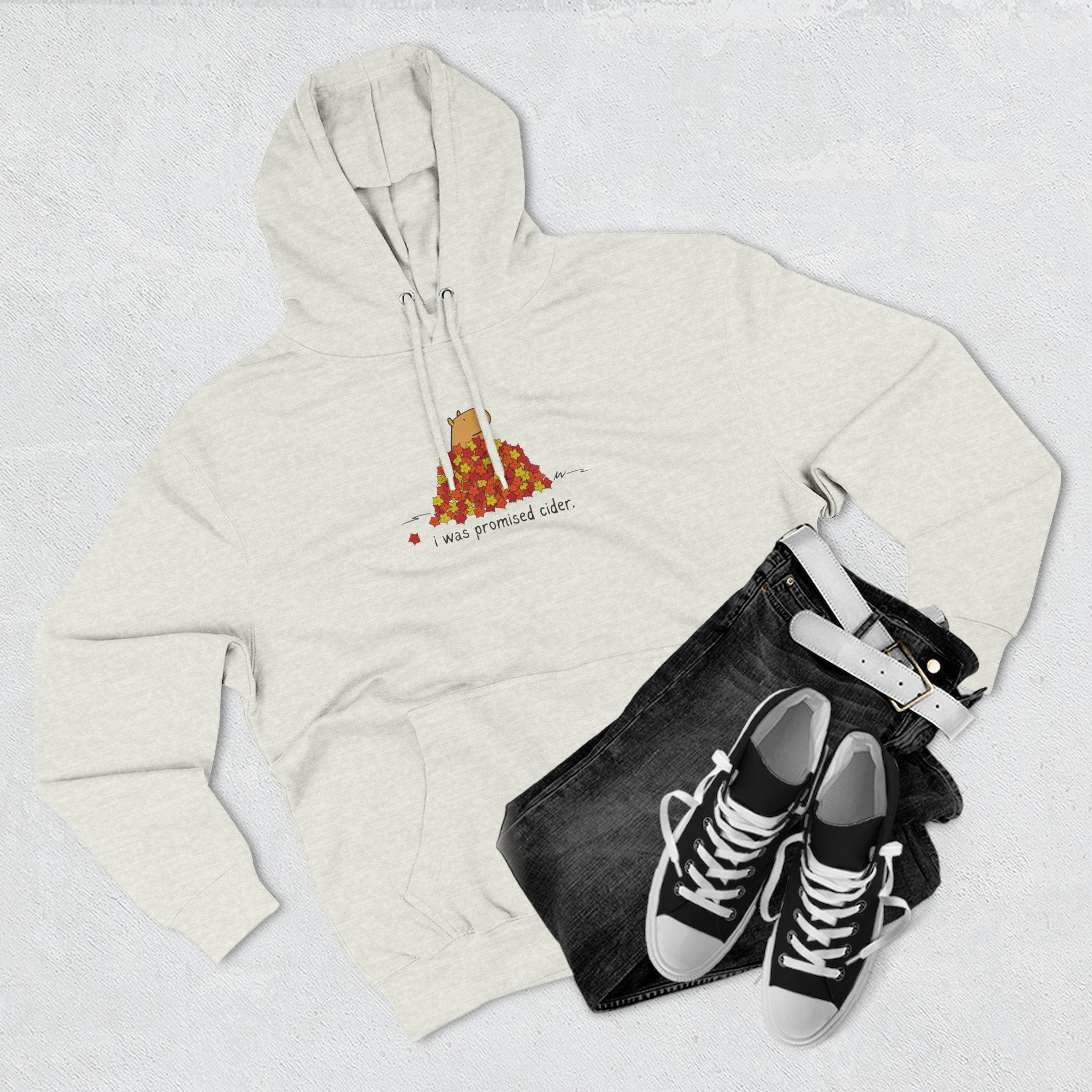 Capy Life fleece hoodie in light grey featuring a capybara in autumn leaves with the text I was promised cider