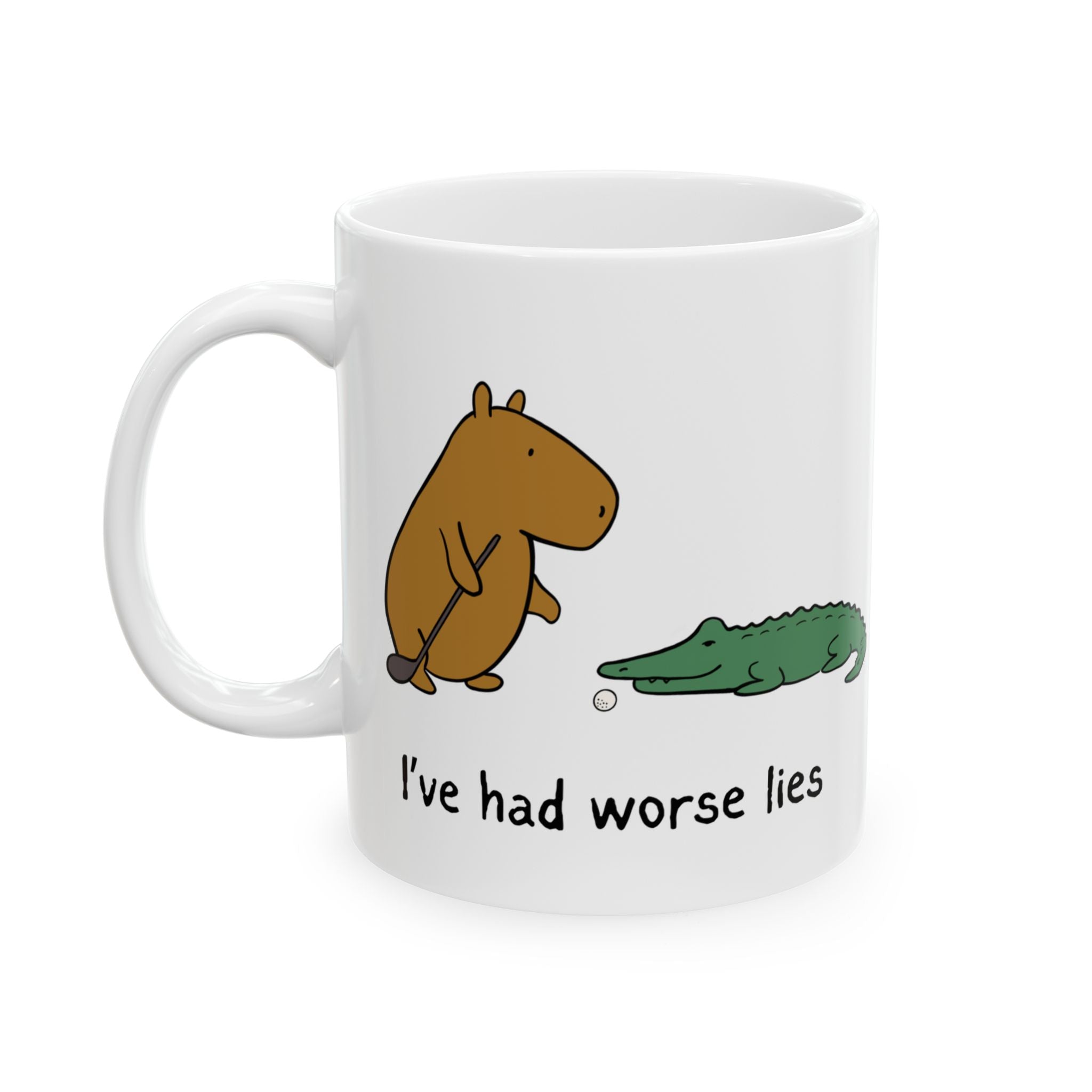 Capy Life white ceramic coffee mug featuring a capybara with a golf club and an alligator with the text I've had worse lies