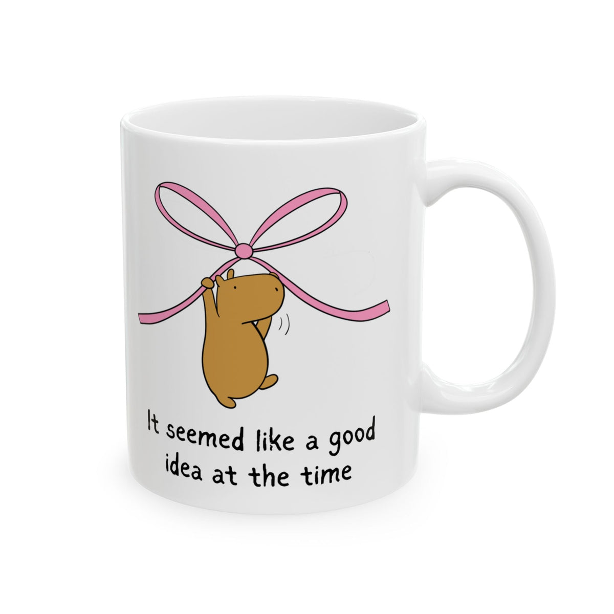 Capy Life white ceramic coffee mug featuring a capybara hanging from a pink ribbon with funny text underneath