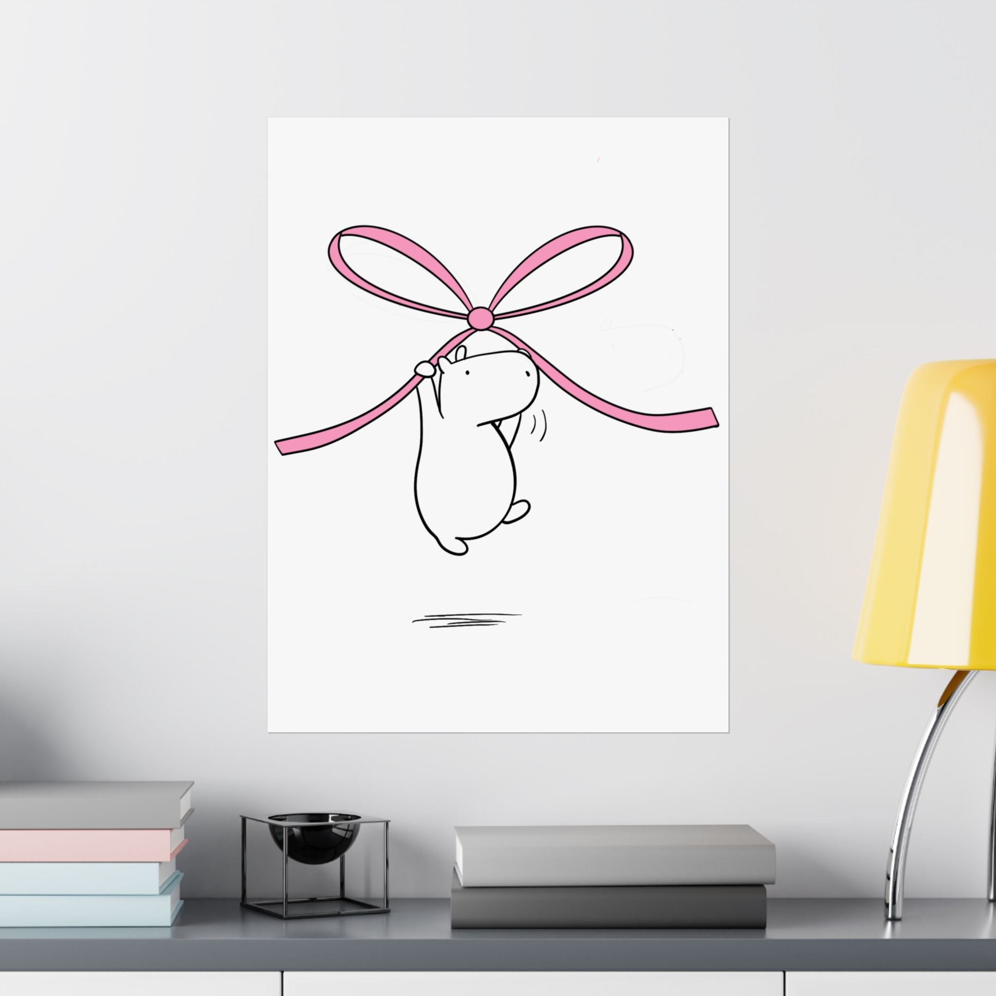 Capy Life minimalist wall art print featuring a cute capybara hanging from a large pink bow on a white background.