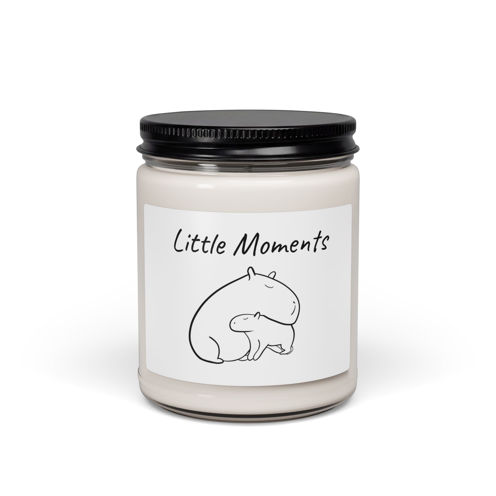 Capy Life white sage lavender scented soy candle in a glass jar with a minimalist label featuring a capybara and baby illustration.