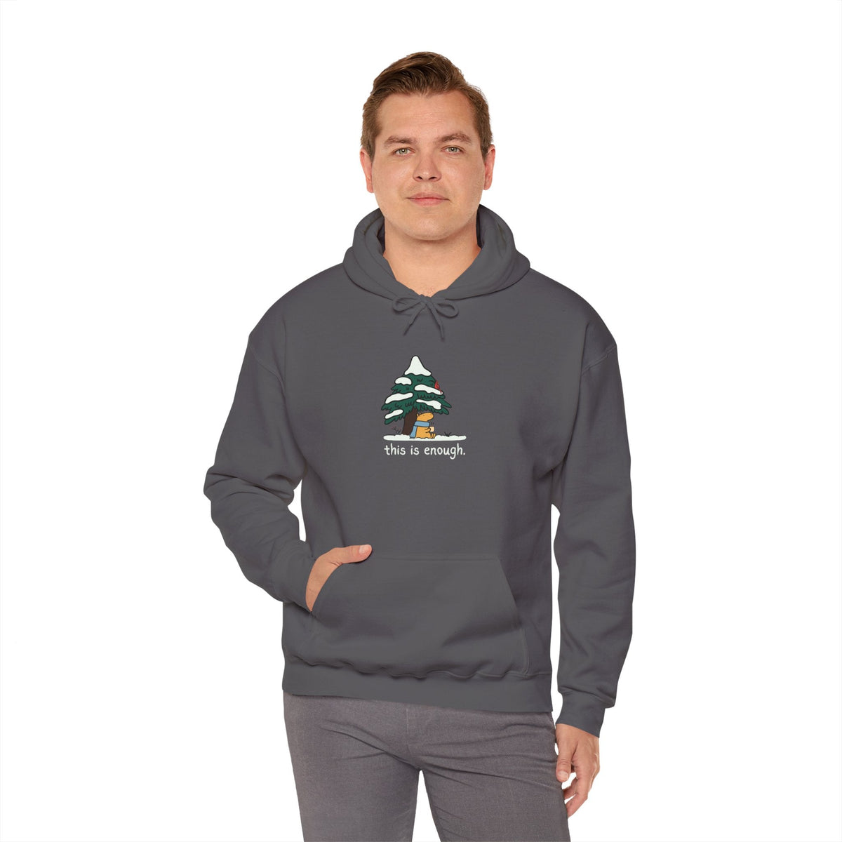 Capy Life charcoal grey pullover hoodie featuring a cute capybara under a snowy tree with the text this is enough
