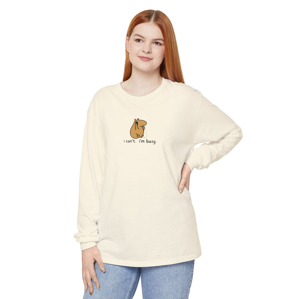 Capy Life cream long sleeve tee featuring a hand-drawn capybara graphic with the text I can't. I'm busy.