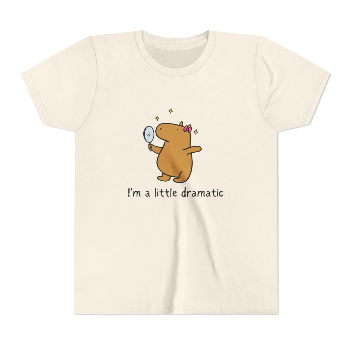 Capy Life youth t-shirt in cream featuring a cute capybara with a pink bow looking into a mirror with sparkles.
