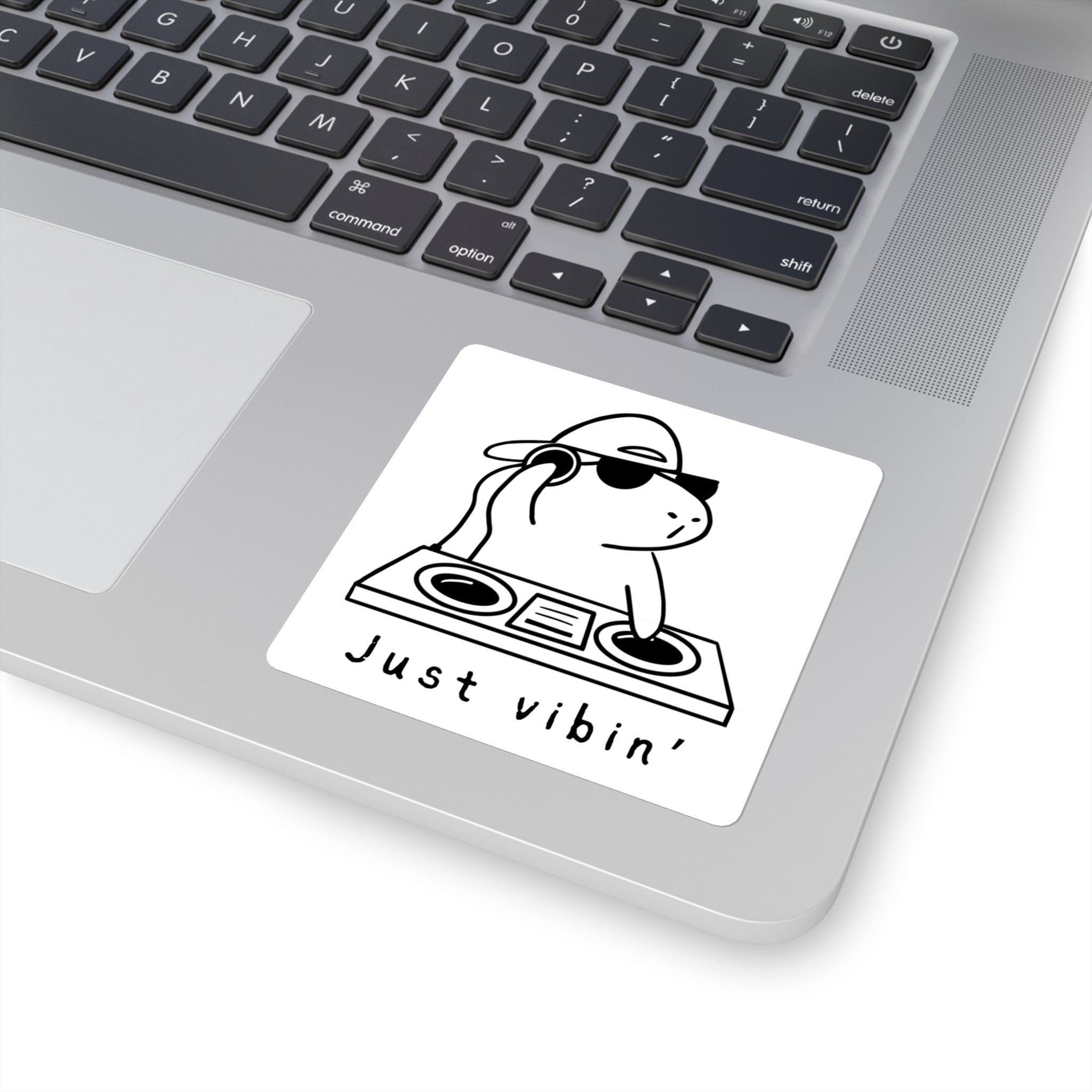 Capy Life vinyl sticker featuring a DJ capybara with headphones and sunglasses on a laptop surface.