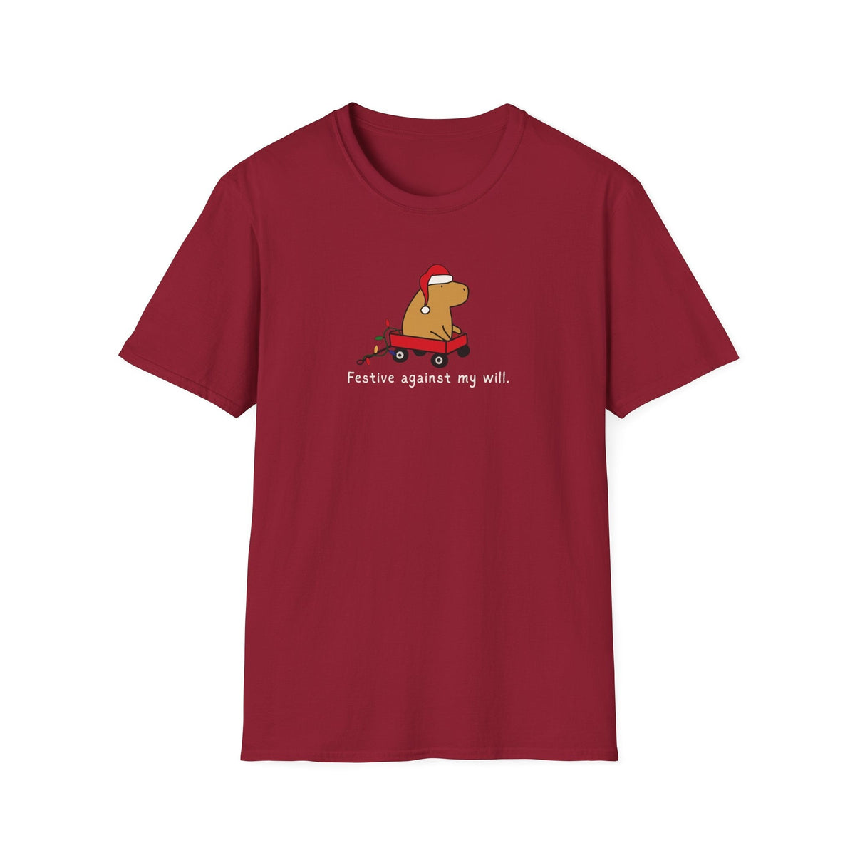 Capy Life red softstyle t-shirt featuring a capybara in a Santa hat and red wagon with the text Festive against my will
