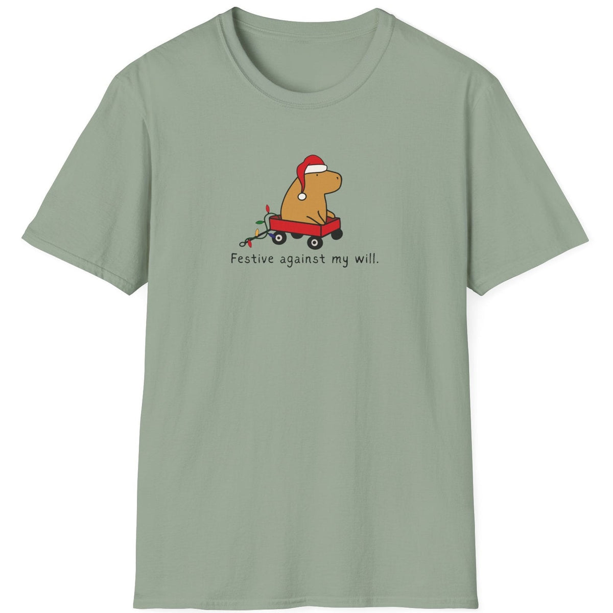 Capy Life softstyle t-shirt in sage green featuring a capybara in a Santa hat and red wagon with festive text.