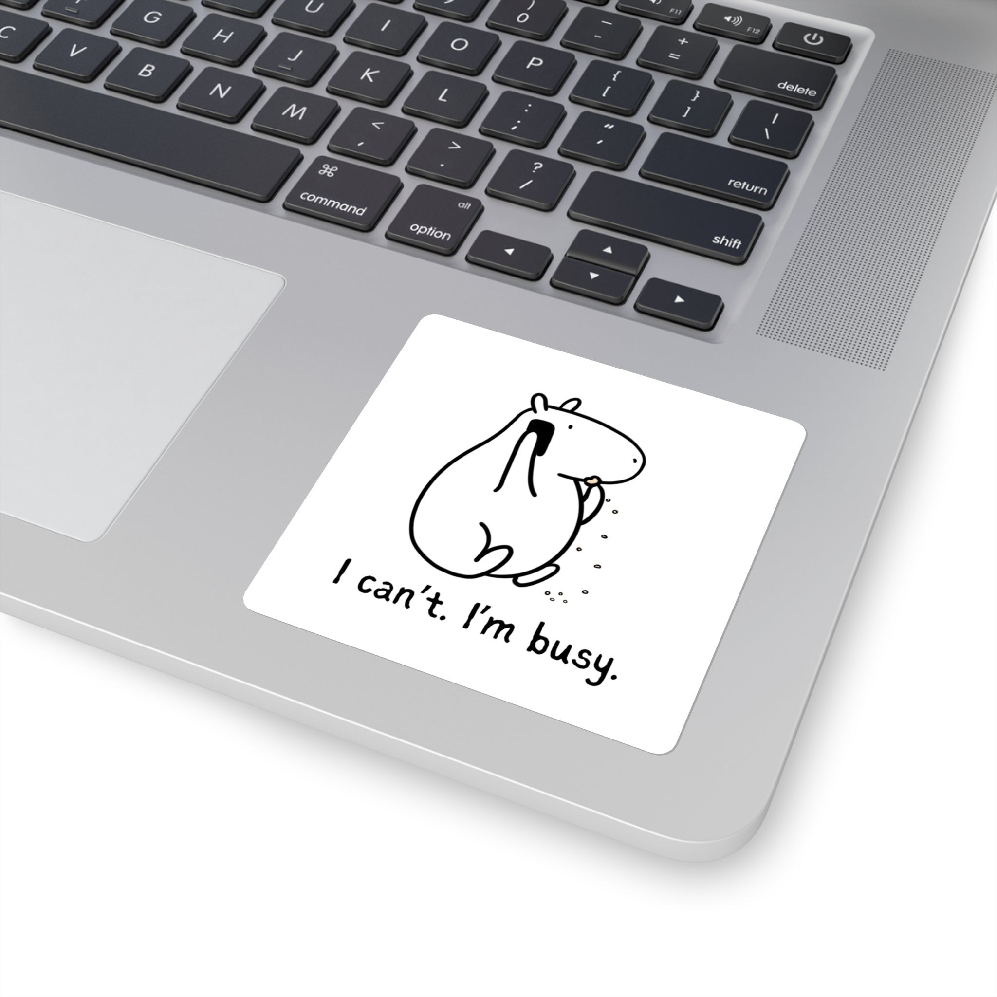 Capy Life funny capybara sticker featuring Gene on the phone eating a snack with the text I can’t. I’m busy. on a laptop.
