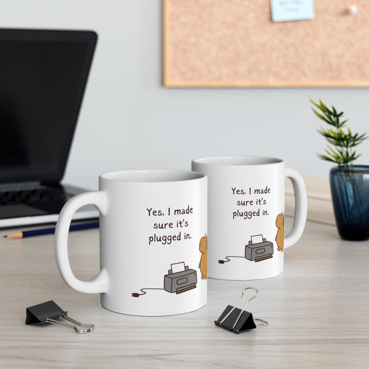 Capy Life white ceramic coffee mug featuring a cute capybara and the text Yes I made sure it is plugged in on a desk