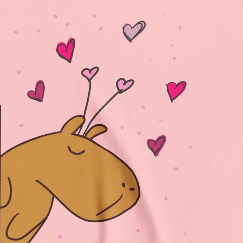 Capy Life pink youth t-shirt featuring a cute Gene the Capybara illustration with floating hearts for Valentine's Day