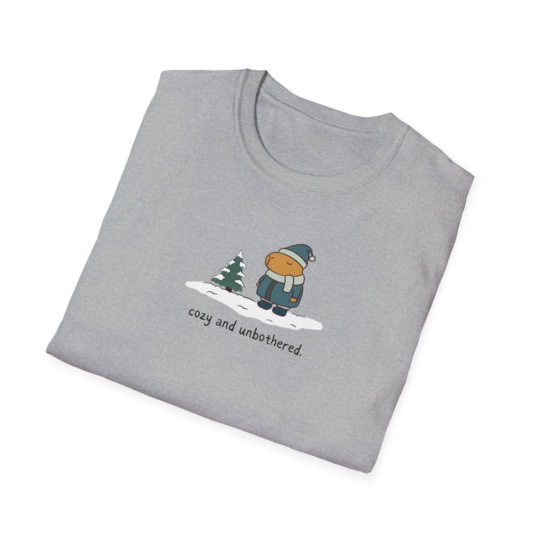 Capy Life grey softstyle t-shirt featuring a graphic of a capybara in winter gear with the text cozy and unbothered.