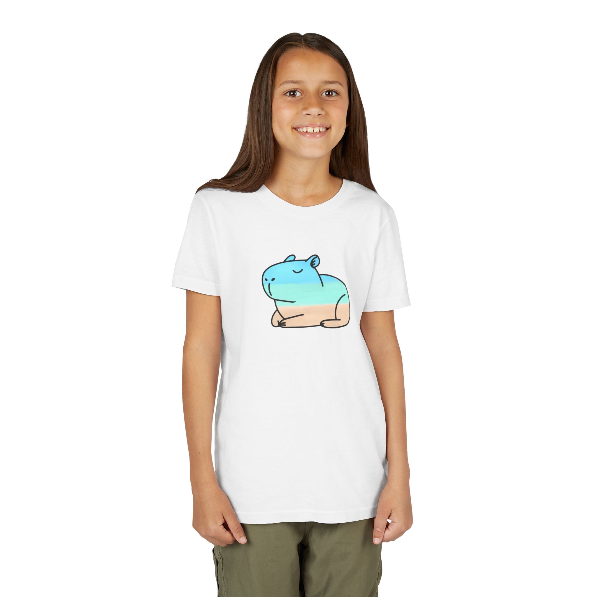Girl wearing a Capy Life white cotton t-shirt featuring a hand-painted coastal capybara graphic in blue and tan.