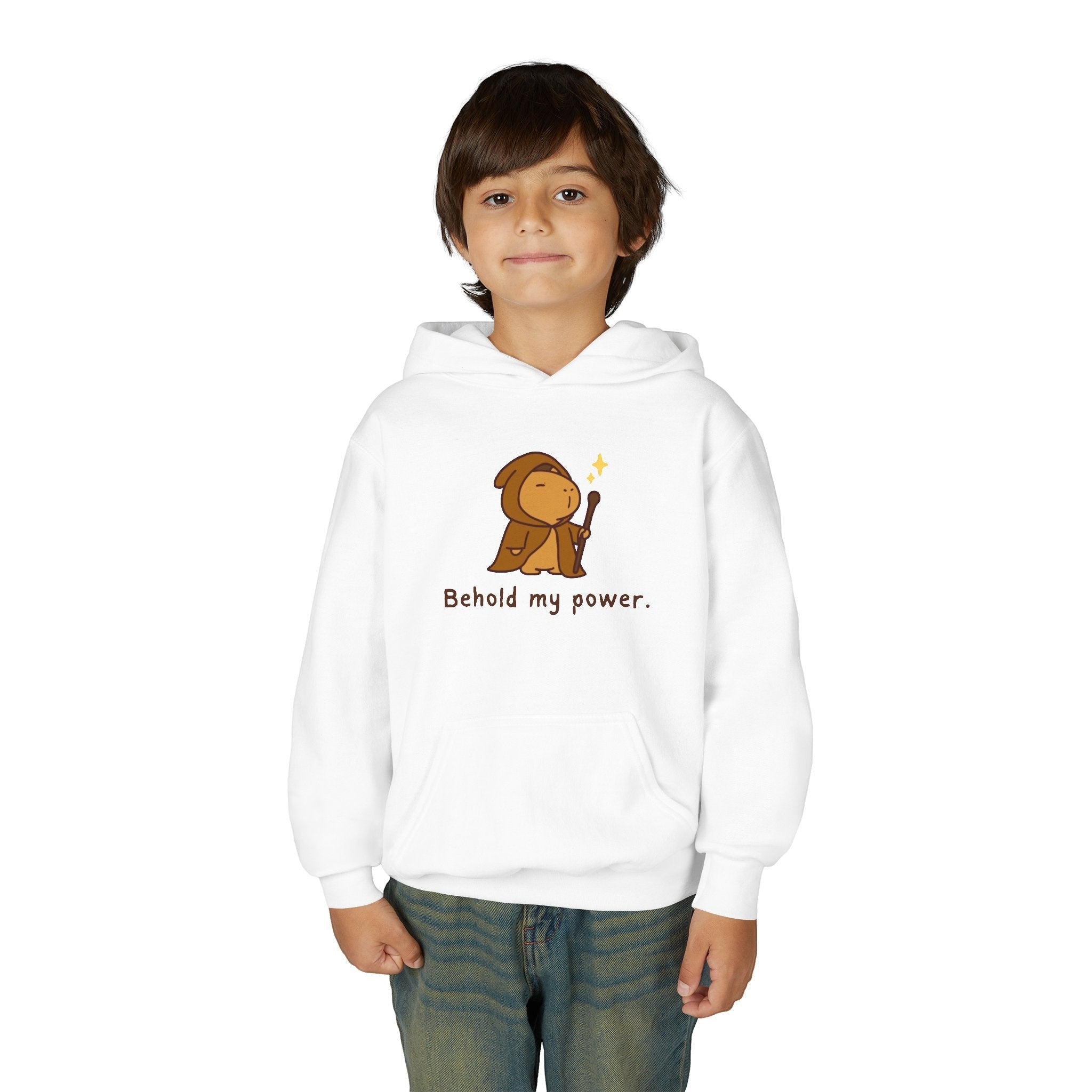 Capy Life kids white pullover hoodie featuring a cute wizard capybara graphic with the text Behold my power