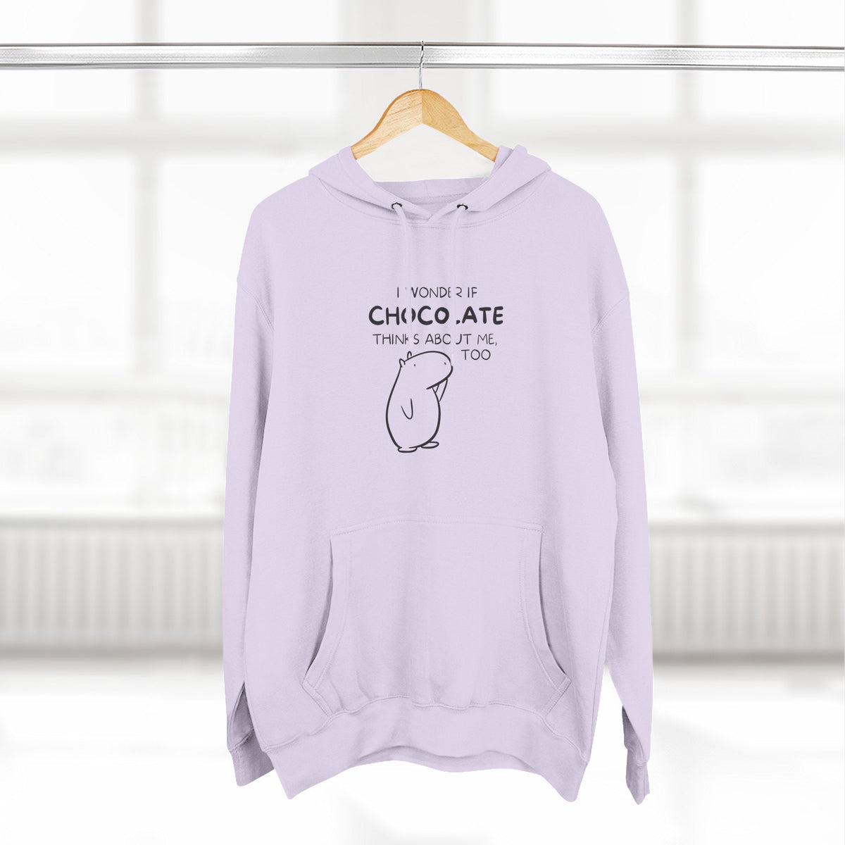 Capy Life lavender hoodie featuring Gene the Capybara line art and the text I wonder if chocolate thinks about me too