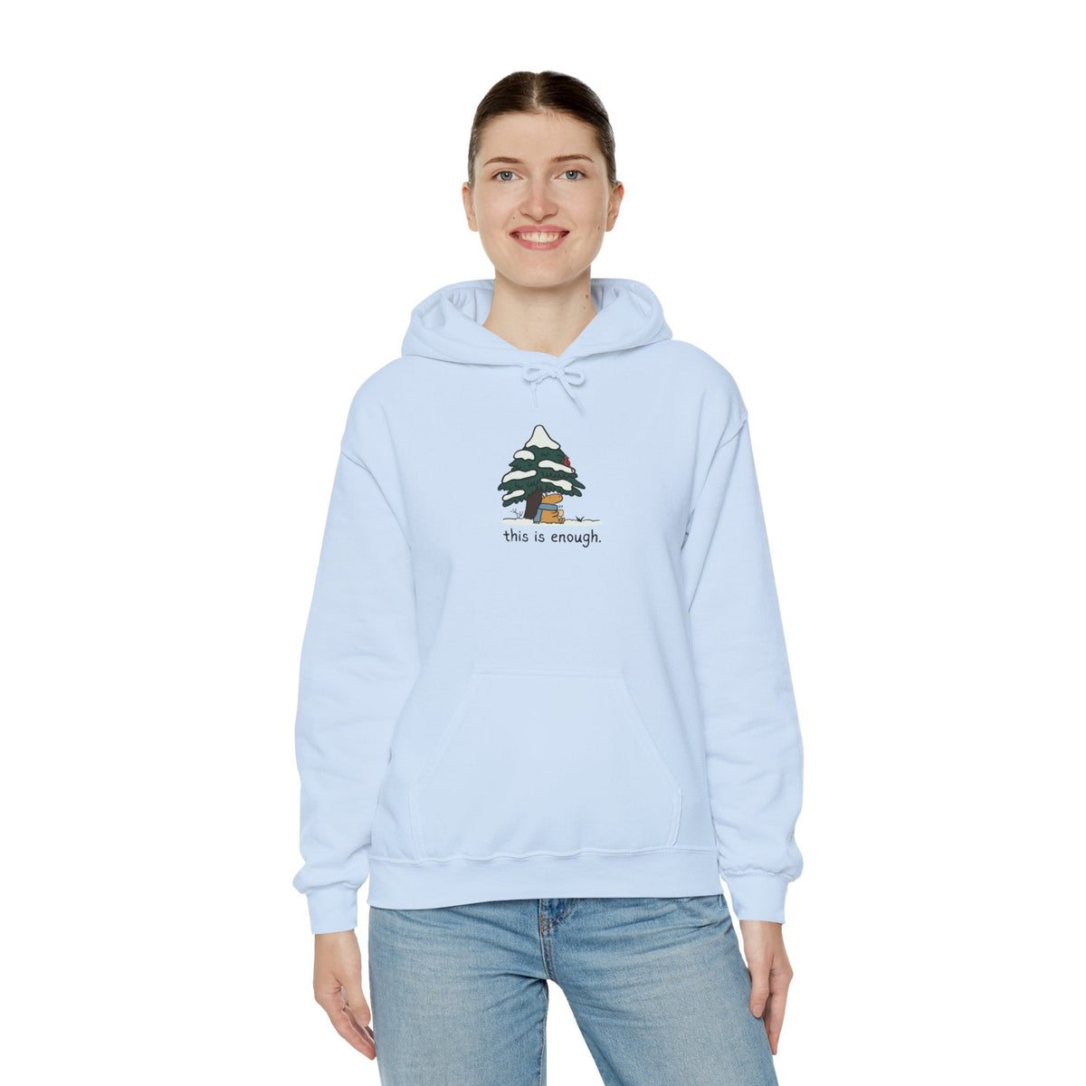 Capy Life light blue pullover hoodie featuring a cute capybara under a snowy tree with the text this is enough