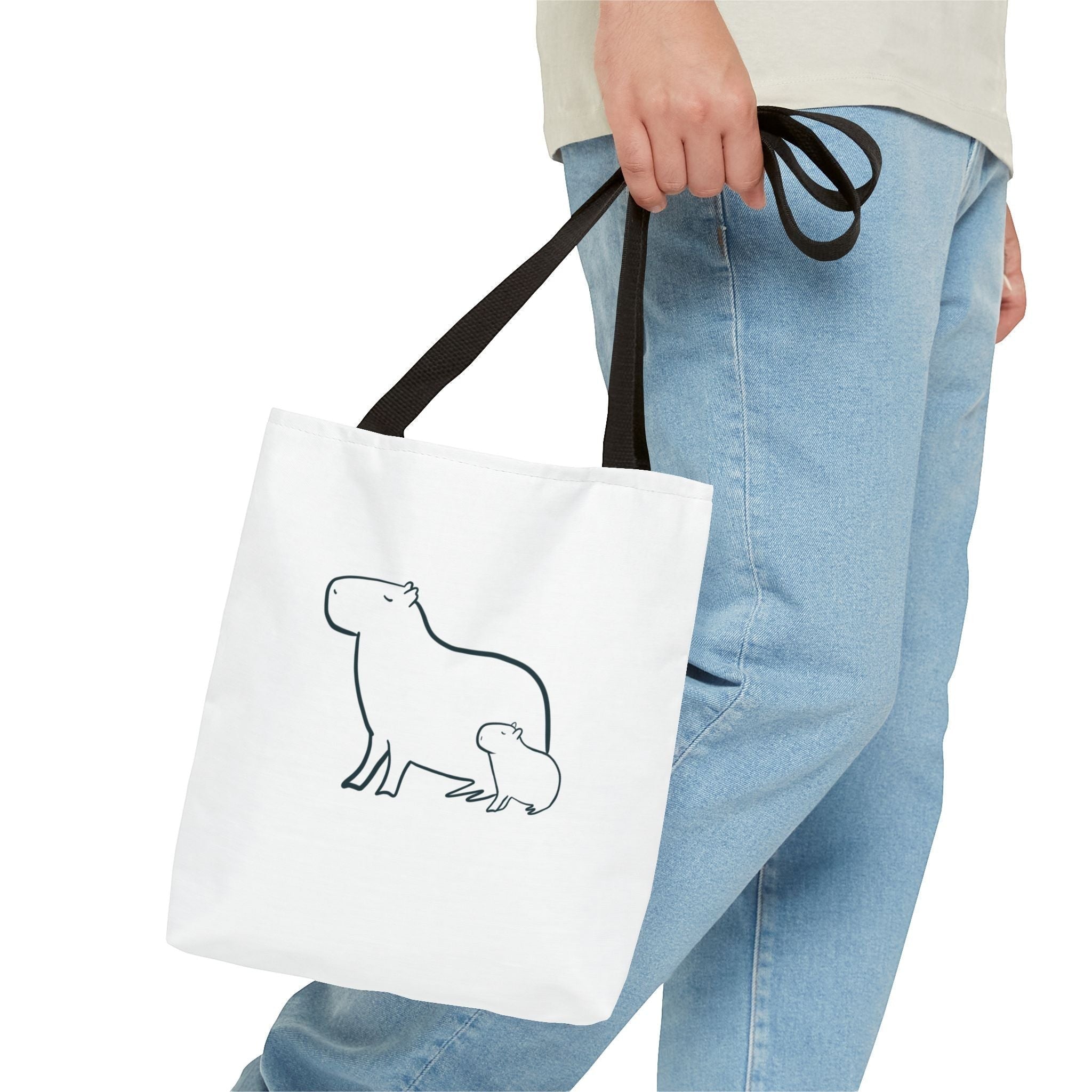 Capy Life white canvas tote bag featuring a minimalist black line art design of a mother and baby capybara.
