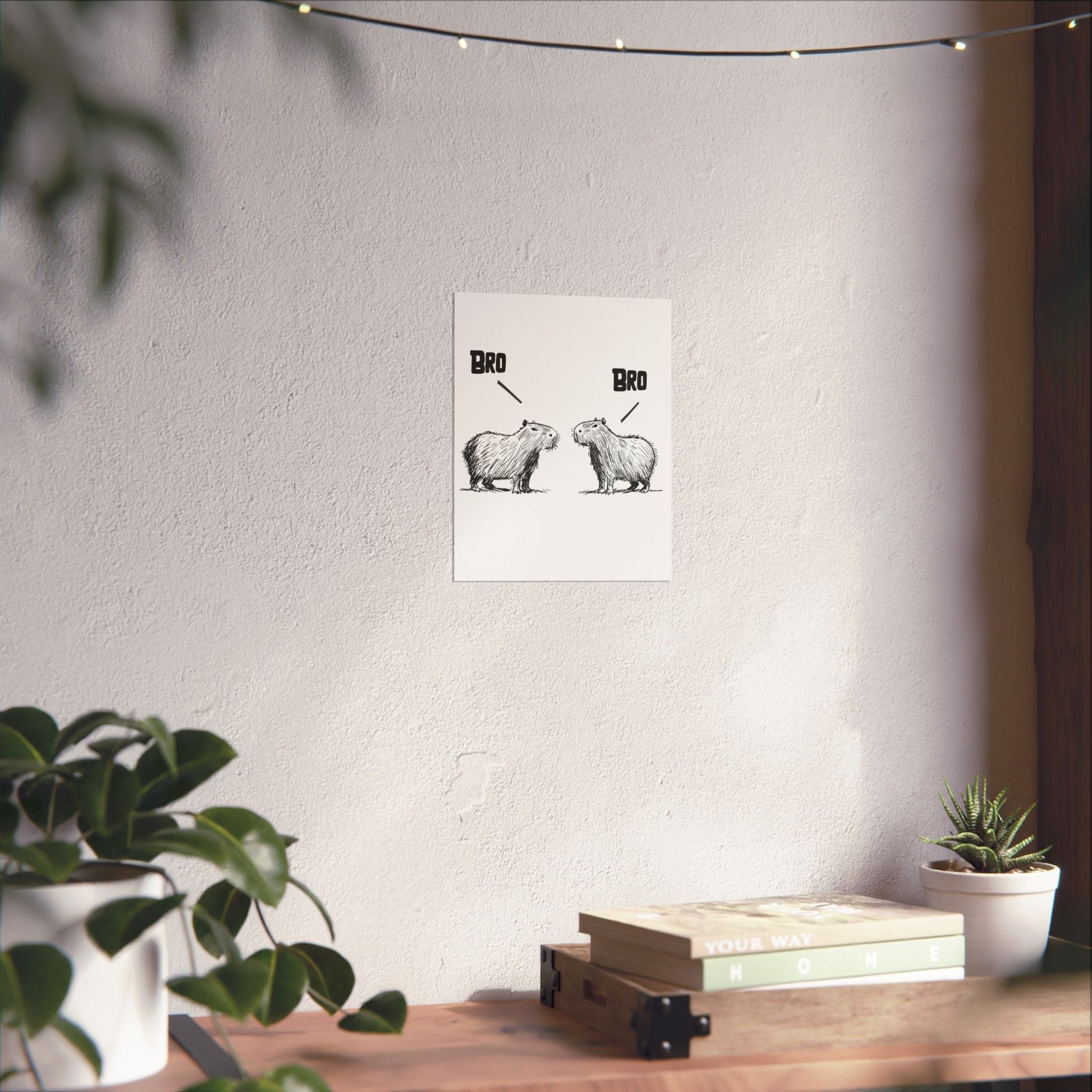 Capy Life minimalist wall art print featuring two hand-drawn capybaras facing each other with the word BRO above them.