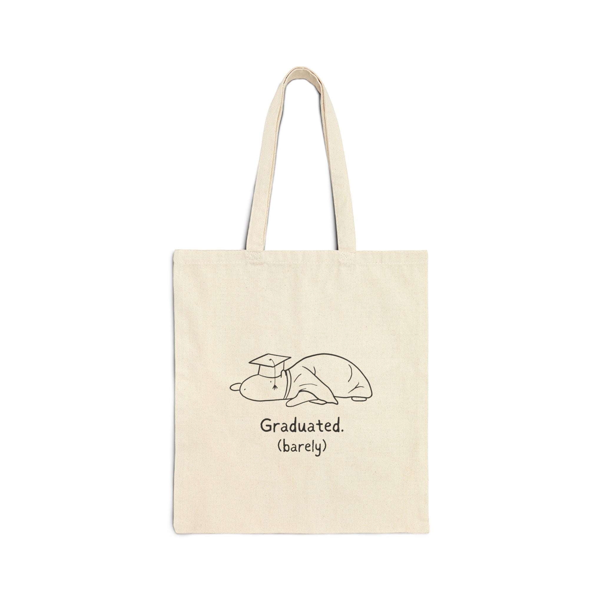 Capy Life natural cotton canvas tote bag featuring a hand-drawn capybara in a graduation cap with Graduated (barely) text