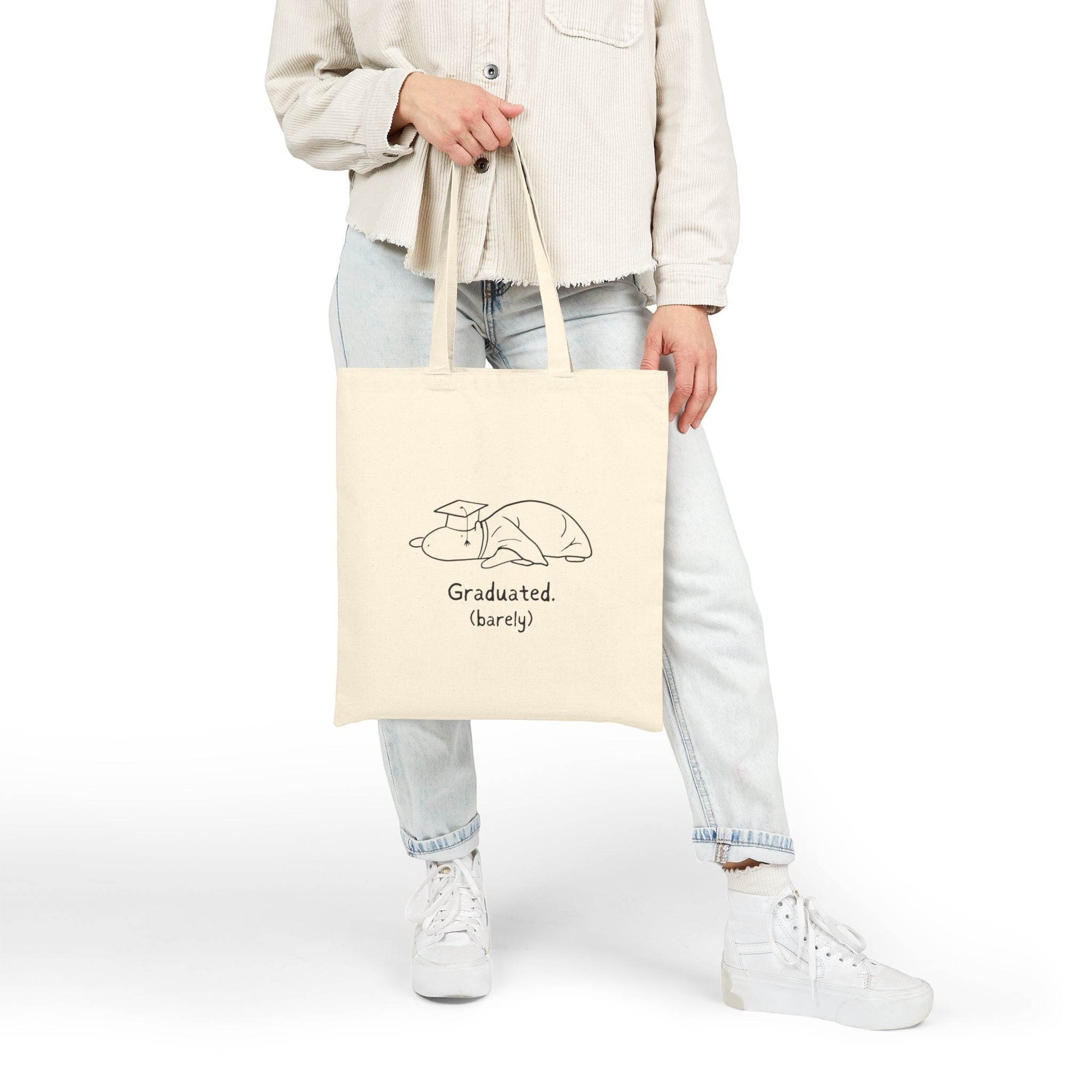 Capy Life natural cotton canvas tote bag featuring a hand-drawn capybara in a graduation cap with funny text.