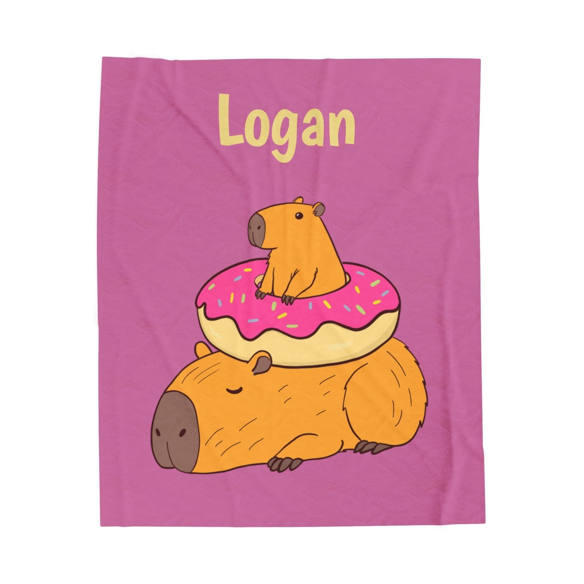 Capy Life personalized kids blanket featuring a cute capybara and donut illustration on a soft pink background.
