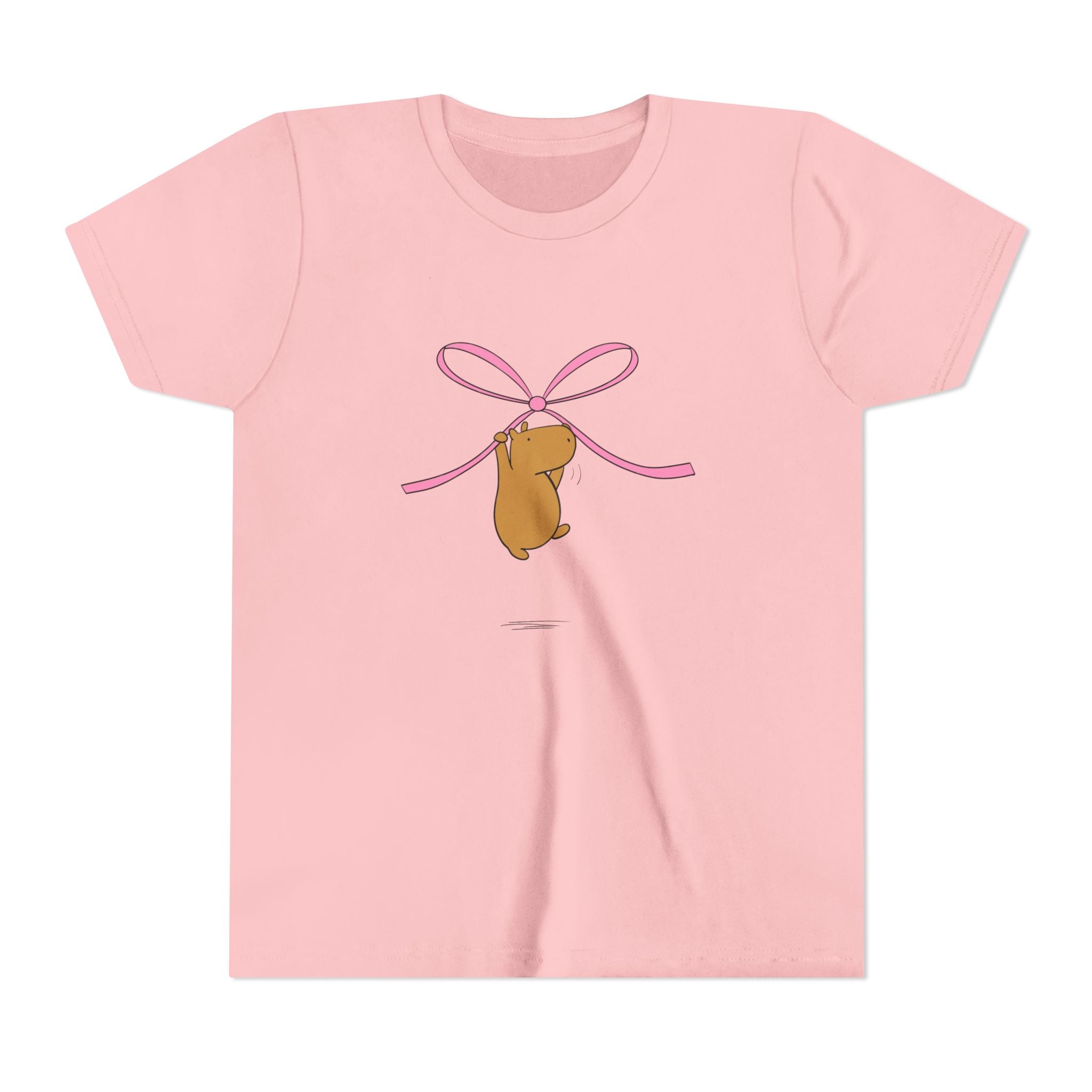 Capy Life kids pink t-shirt featuring a cute capybara hanging from a pink coquette bow graphic