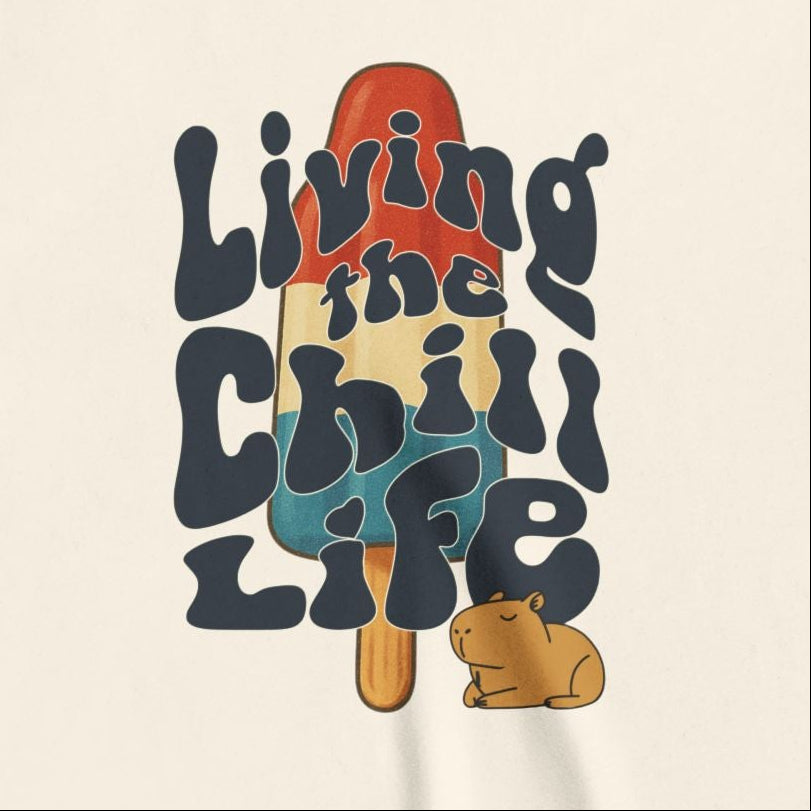 Capy Life youth tee featuring a retro popsicle graphic with a cute capybara and Living the Chill Life text.