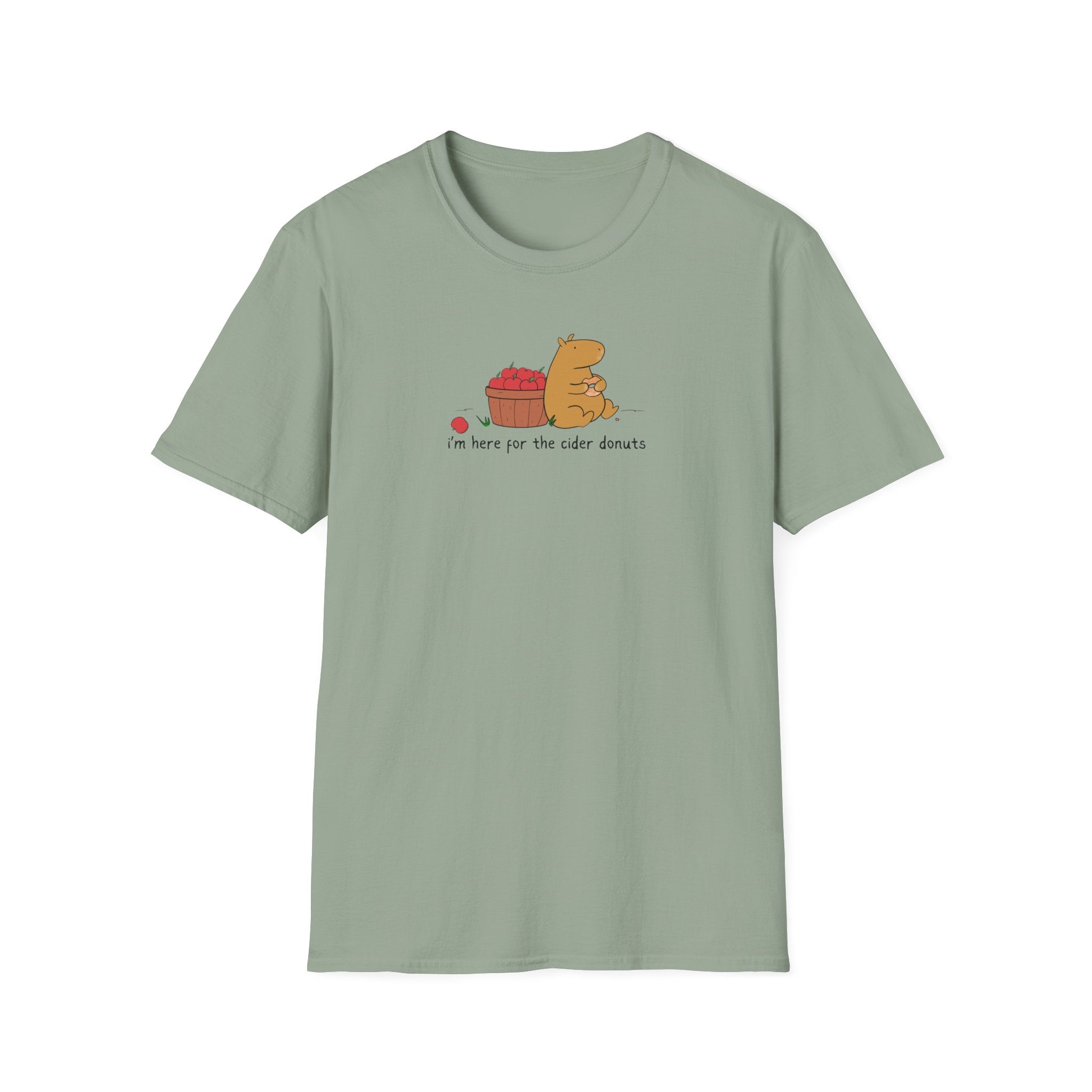 Capy Life sage green softstyle t-shirt featuring a hand-drawn capybara eating a cider donut by a basket of apples.