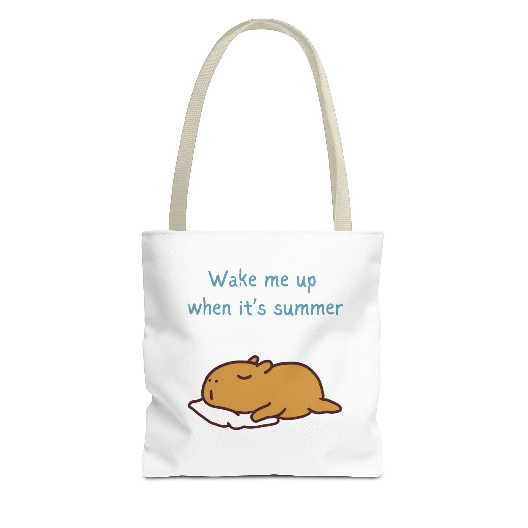 Capy Life white canvas tote bag featuring a cute illustration of a sleeping capybara and the text Wake me up when it's summer.