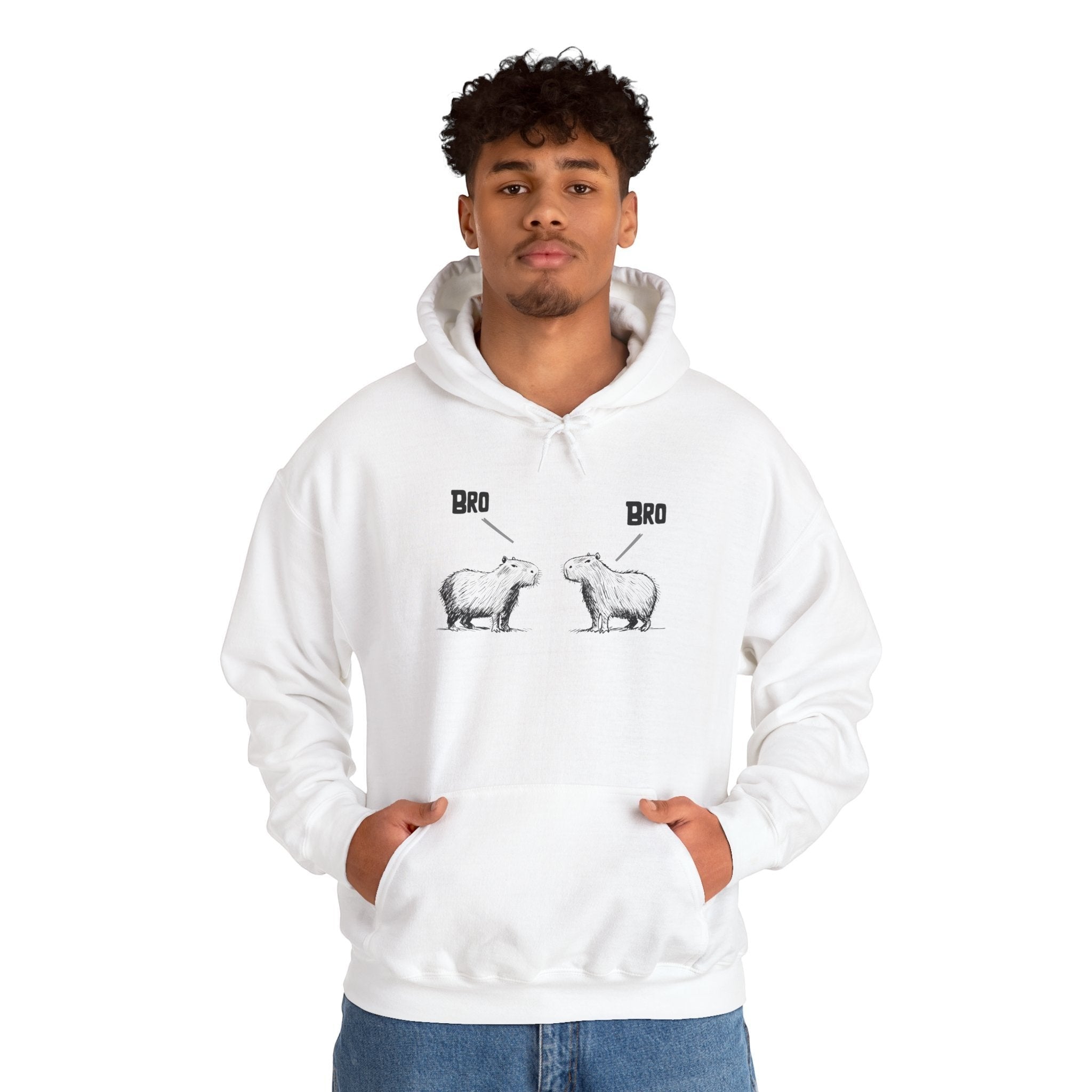 Capy Life white pullover hoodie featuring a funny sketch of two capybaras saying Bro, worn by a young man.