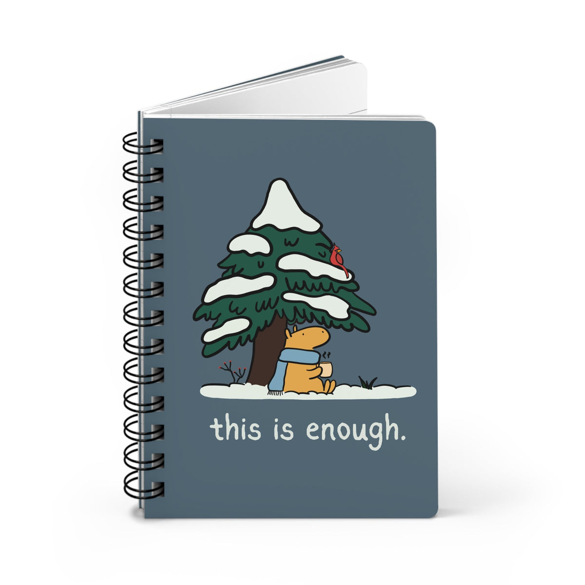 Capy Life spiral notebook with a blue cover featuring a capybara in a scarf under a snowy tree with a red cardinal.