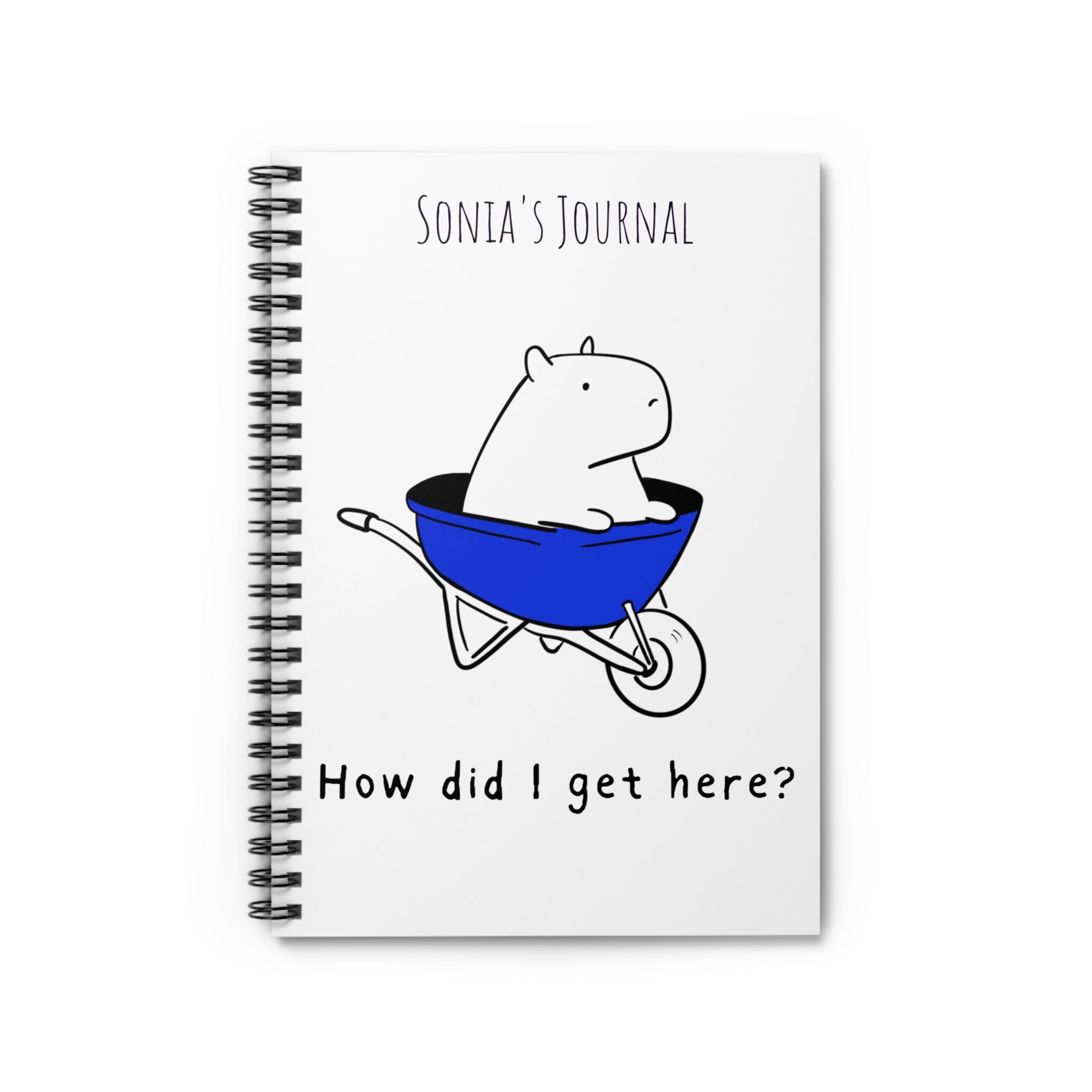 Personalized journal with cute capybara character in blue wheelbarrow and text "Sonia's Journal, How did I get here?