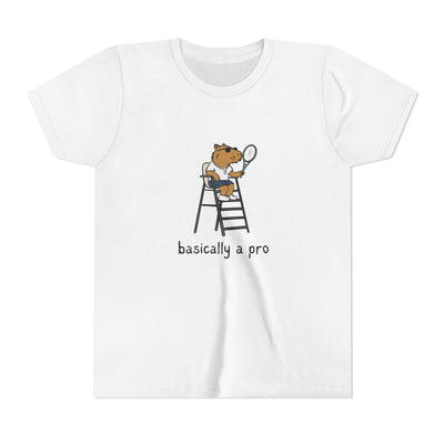 White t-shirt with a graphic of a capybara on a ladder holding a tennis racket and the text 'basically a pro' on a white background.
