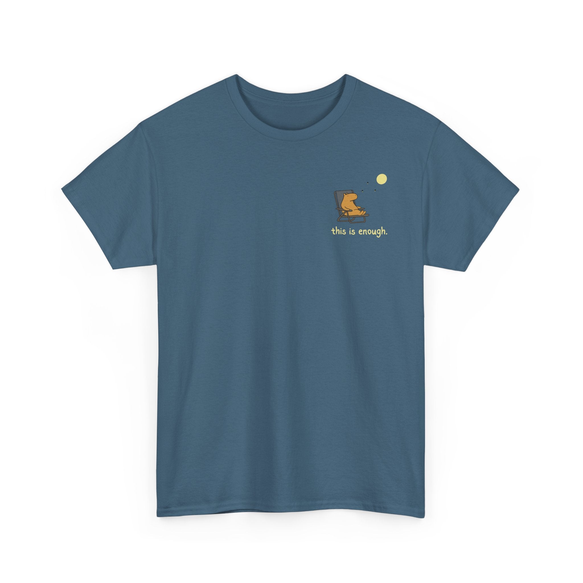 A slate blue crewneck t-shirt with a small graphic on the left chest showing a yellow moon, a capybara watching the moon, and the text 'this is enough.' in yellow, displayed on a clean white background.