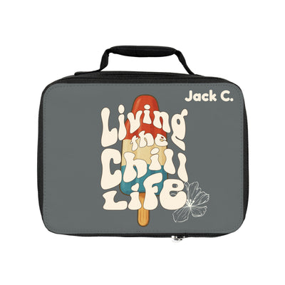 Insulated lunch tote featuring retro-styled text "Living the Chill Life" and a flower graphic in shades of gray, orange, and blue.