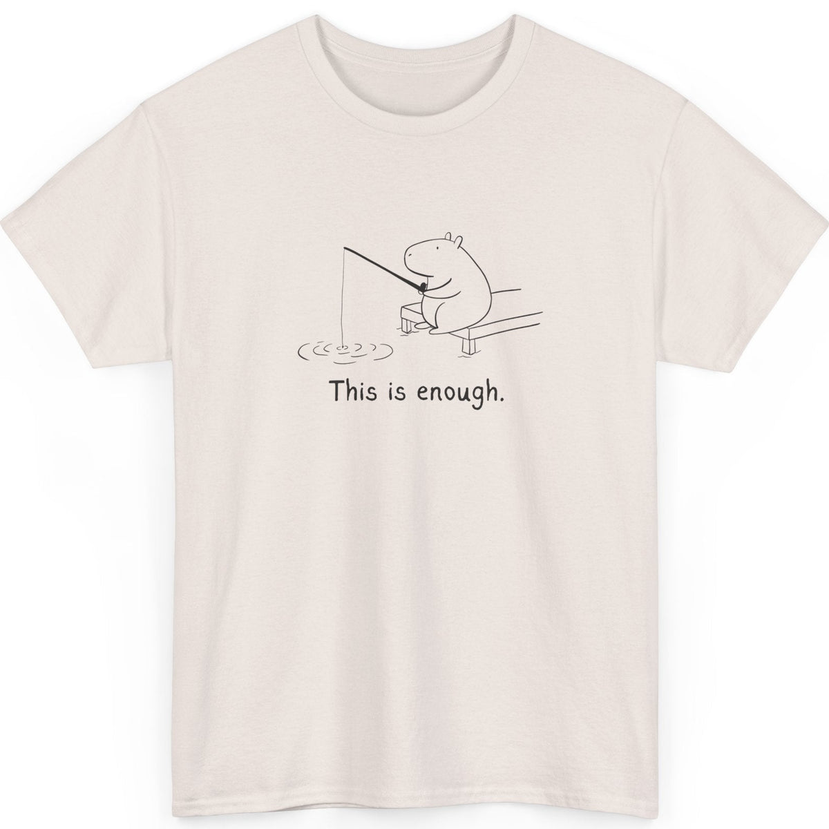 Beige t-shirt with a capybara fishing and text 'This is enough' on a white background