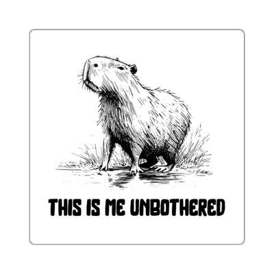 Illustration of a serene capybara standing in water with text "THIS IS ME UNBOTHERED" - black and white vinyl sticker design.