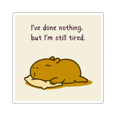 Funny glossy sticker featuring a sleepy capybara character and the text "I've done nothing, but I'm still tired".