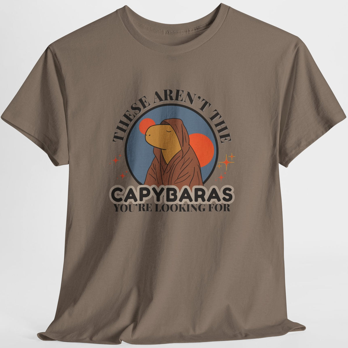 Brown t-shirt with capybara jedi graphic and the text "these aren't the capybaras you're looking for" on a white background